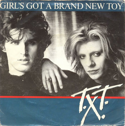 T.X.T. - Girl's Got A Brand New Toy (7") - USED